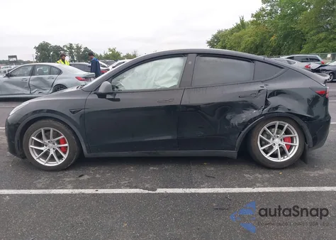 2023 Tesla Model Y Performance Dual Motor All-Wheel Drive z USA, uszkodzony, nr VIN 7SAYGDEF7PF980571